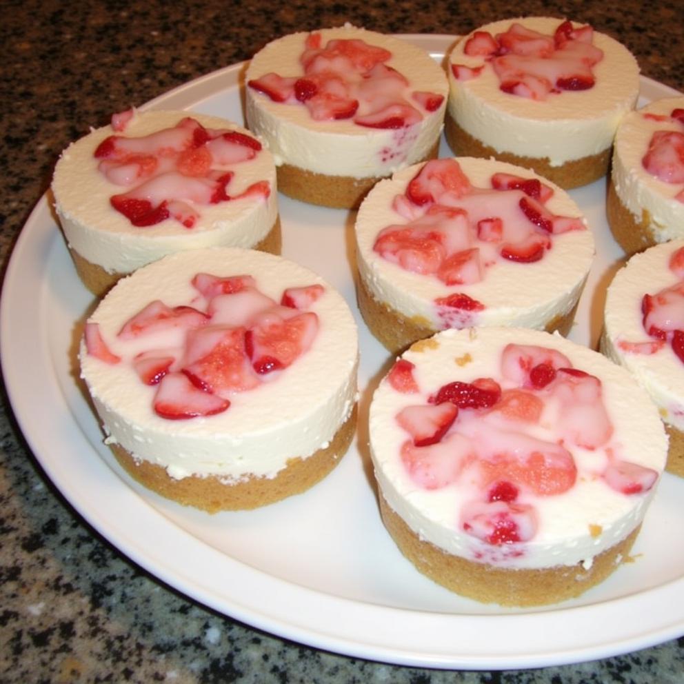 Mini Strawberry Swirl Cheesecakes