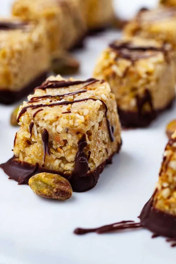 Healthy coconut bites with chocolate and pistachios