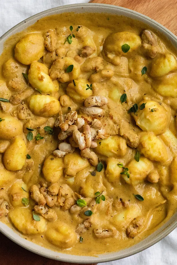 vegan creamy acorn squash gnocchi with crispy white beans