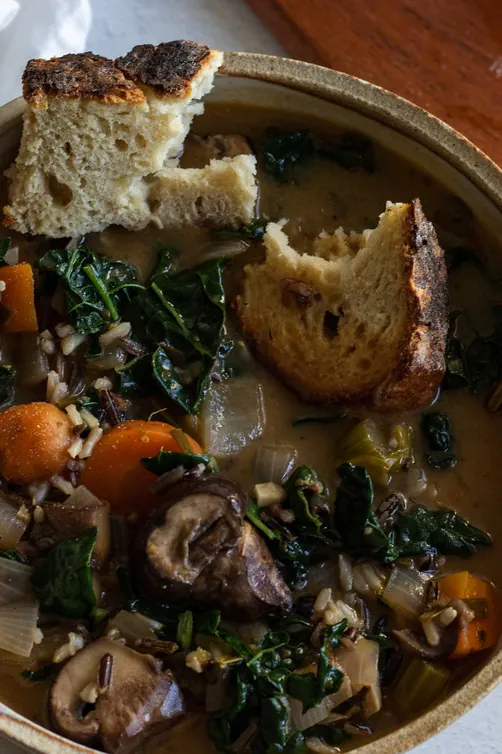 creamy vegan mushroom and wild rice soup with coconut milk