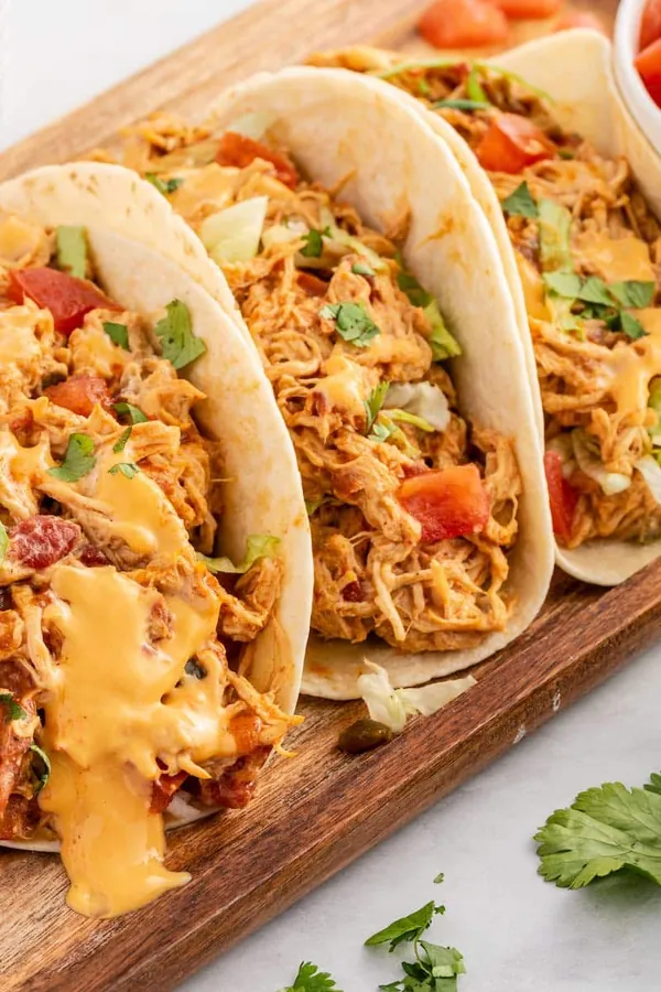 Slow Cooker Queso Chicken Tacos
